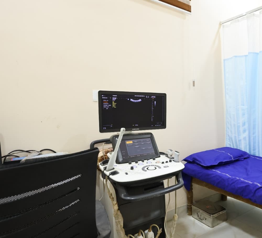 An ultrasound room, with the scanner, monitor and examination couch